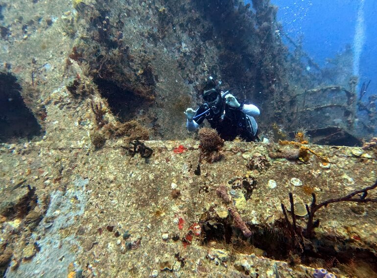 Advanced Open Water diver exploring the Atlantic Princess wreck during a guided training dive