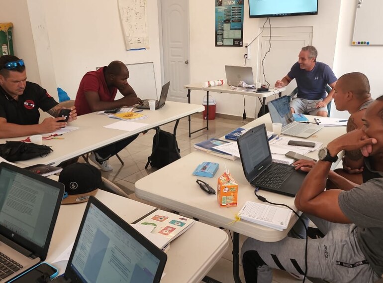 Divemaster candidates completing professional scuba theory training