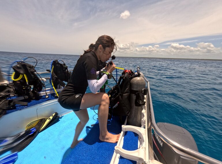 Ultra Marine Divers guest preparing scuba equipment on the Bayahibe dive boat