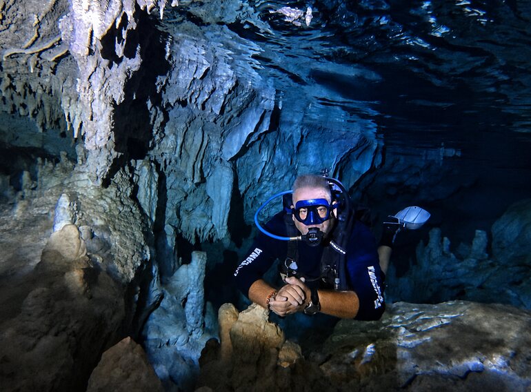 Certified scuba diver exploring a freshwater cavern in the Dominican Republic