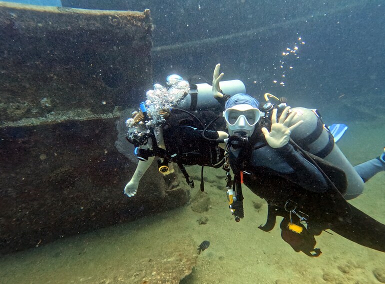 First-time scuba divers exploring the shallow Atlantic Princess wreck with Ultra Marine Divers near Bayahibe