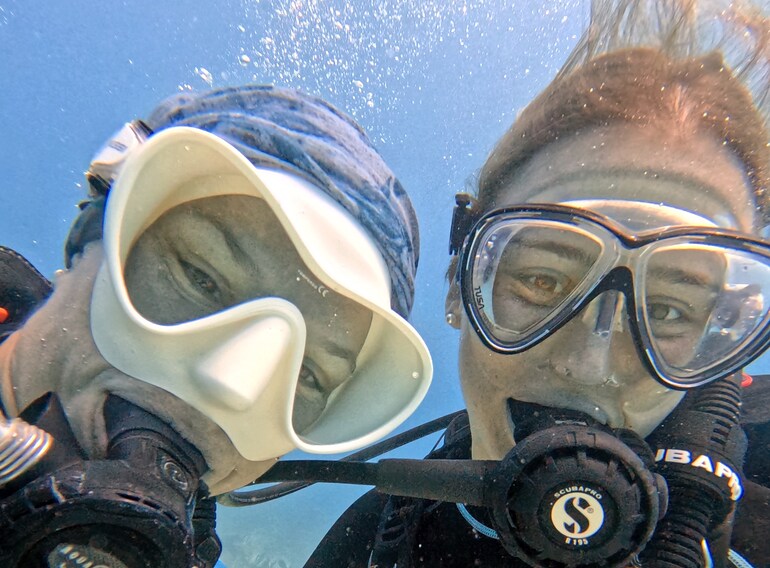 Happy first-time scuba divers enjoying their Discover Scuba Diving experience in the Caribbean Sea