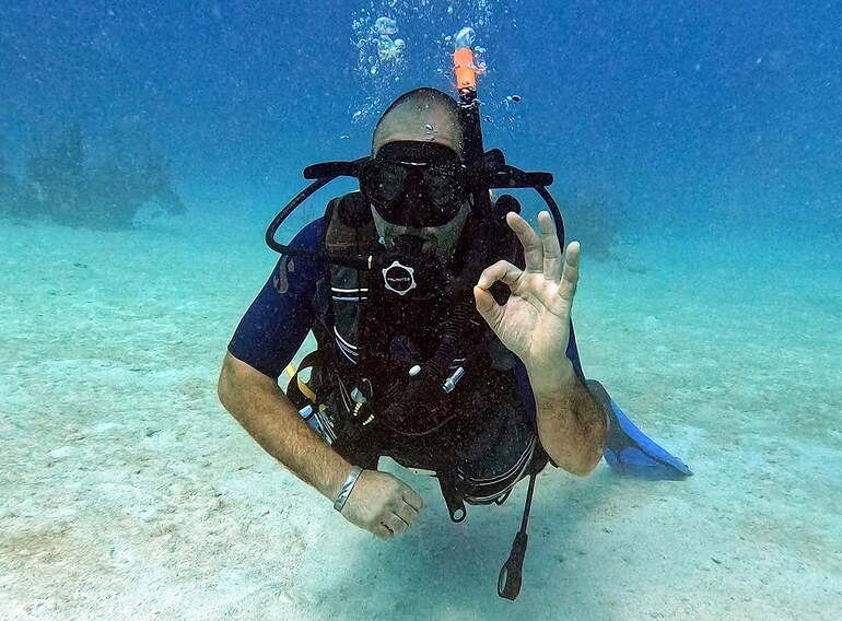 Open Water Diver student showing the OK signal during a Caribbean Sea training dive near Bayahibe