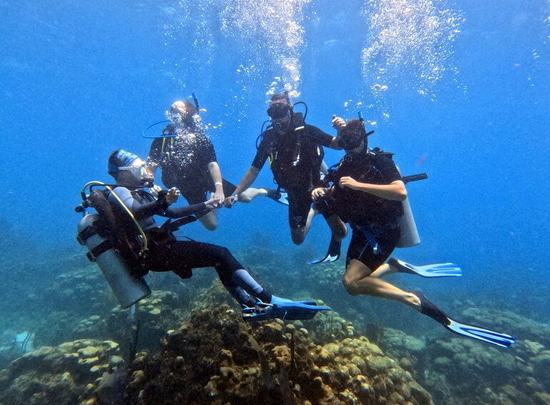 Small group of scuba students and instructors training in the Caribbean Sea near Bayahibe